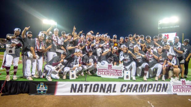Jun 30, 2021; Omaha, Nebraska, USA;  The Mississippi St. Bulldogs pose for a team photo after winning the national championship against the Vanderbilt Commodores at TD Ameritrade Park.