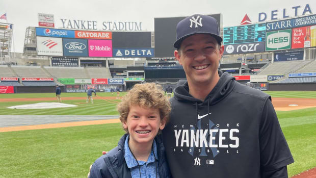 Kid Reporter Cillian Johnson and Yankees pitching coach Matt Blake.