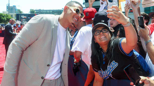 Manny Machado poses for a selfie with a fan.