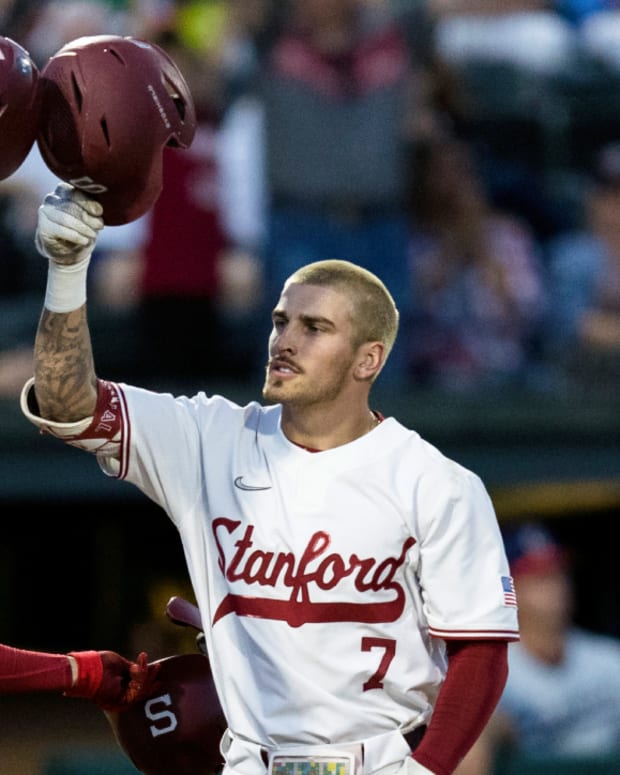Stanford’s Brock Jones (7) celebrates with Carter Graham (31) after hitting a two-run home run against Connecticut during the second inning of an NCAA college baseball tournament super regional game Saturday, June 11, 2022, in Stanford, Calif.