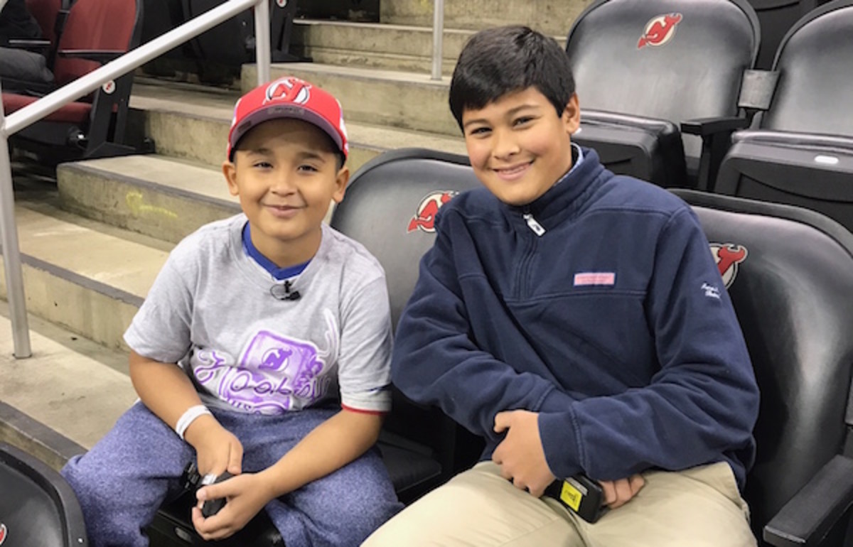 Devils coach for the day Abdiel Collazo with Kid Reporter Christopher John