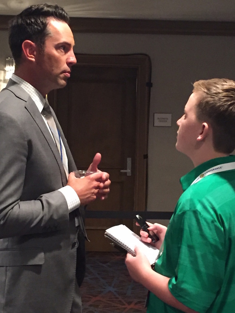 Kid Reporter Jack Ronilo with broadcaster Joe Tessitore