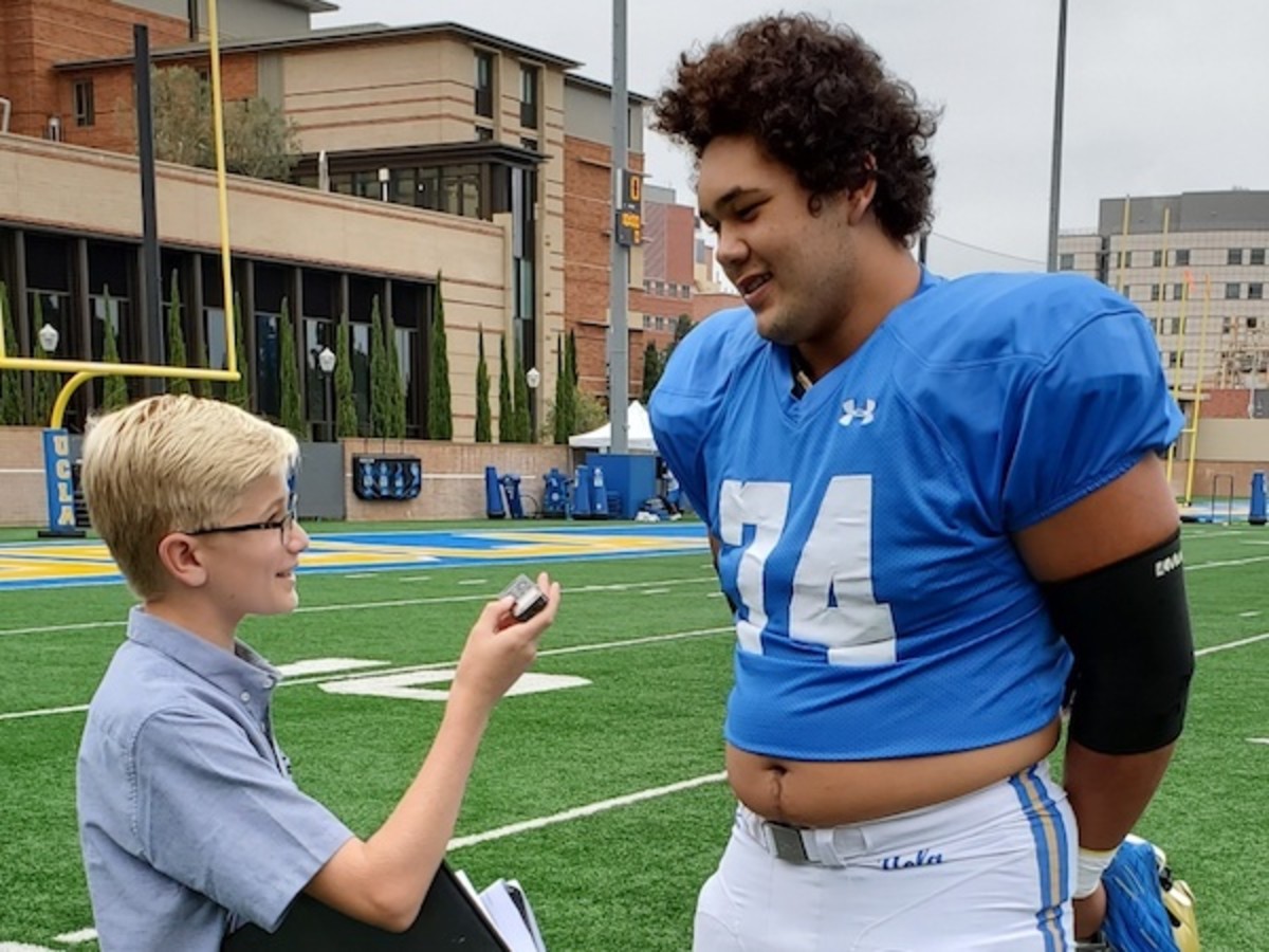 Kid Reporter Carlo Vellandi and offensive tackle Sean Rhyan