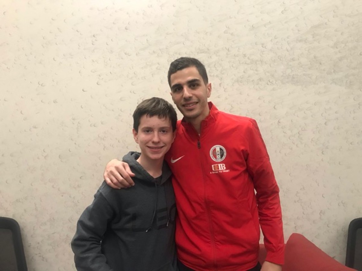 SI Kids reporter Ian Springer with Egypt's Ali Farag, the World No. 1 player.